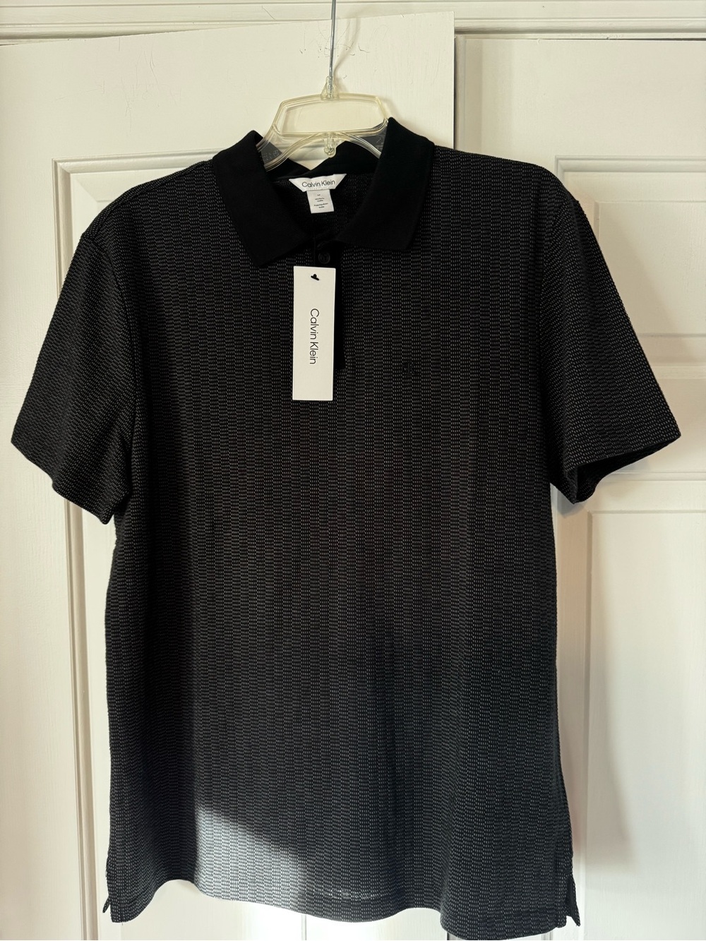 Calvin Klein Men's Black Textured Polo with Subtle Pattern